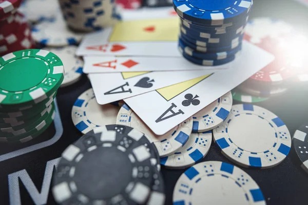 Live dealer shaking three dice in transparent container